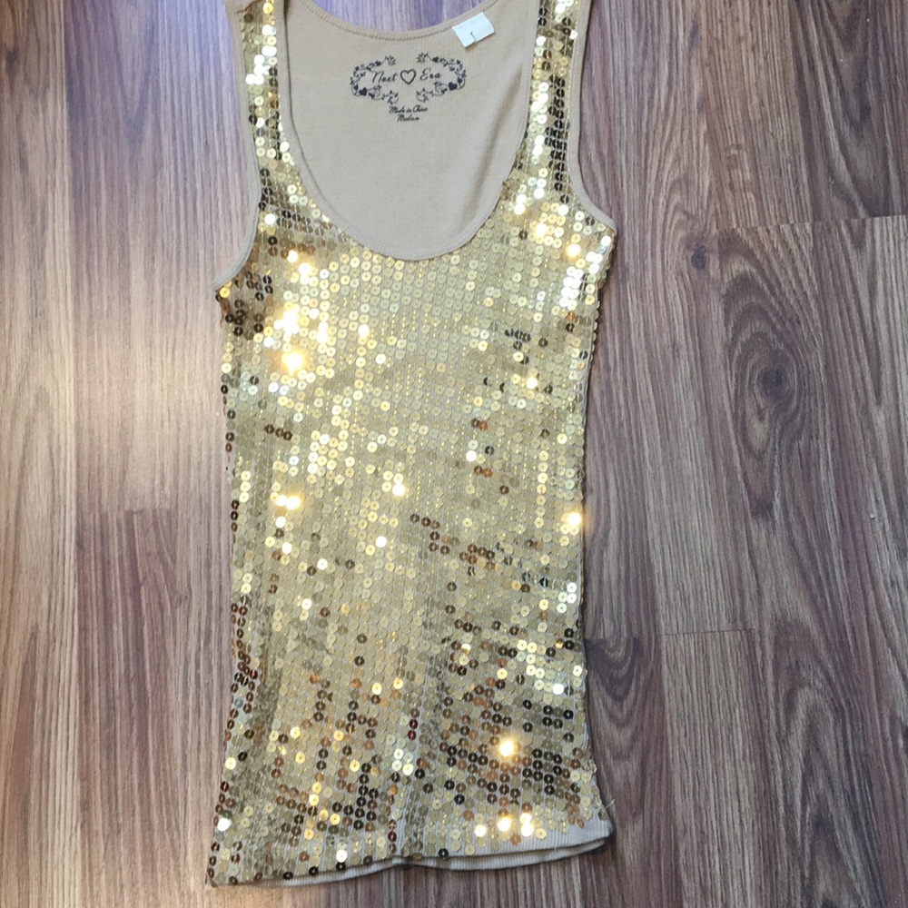 Gold sequin tank top.